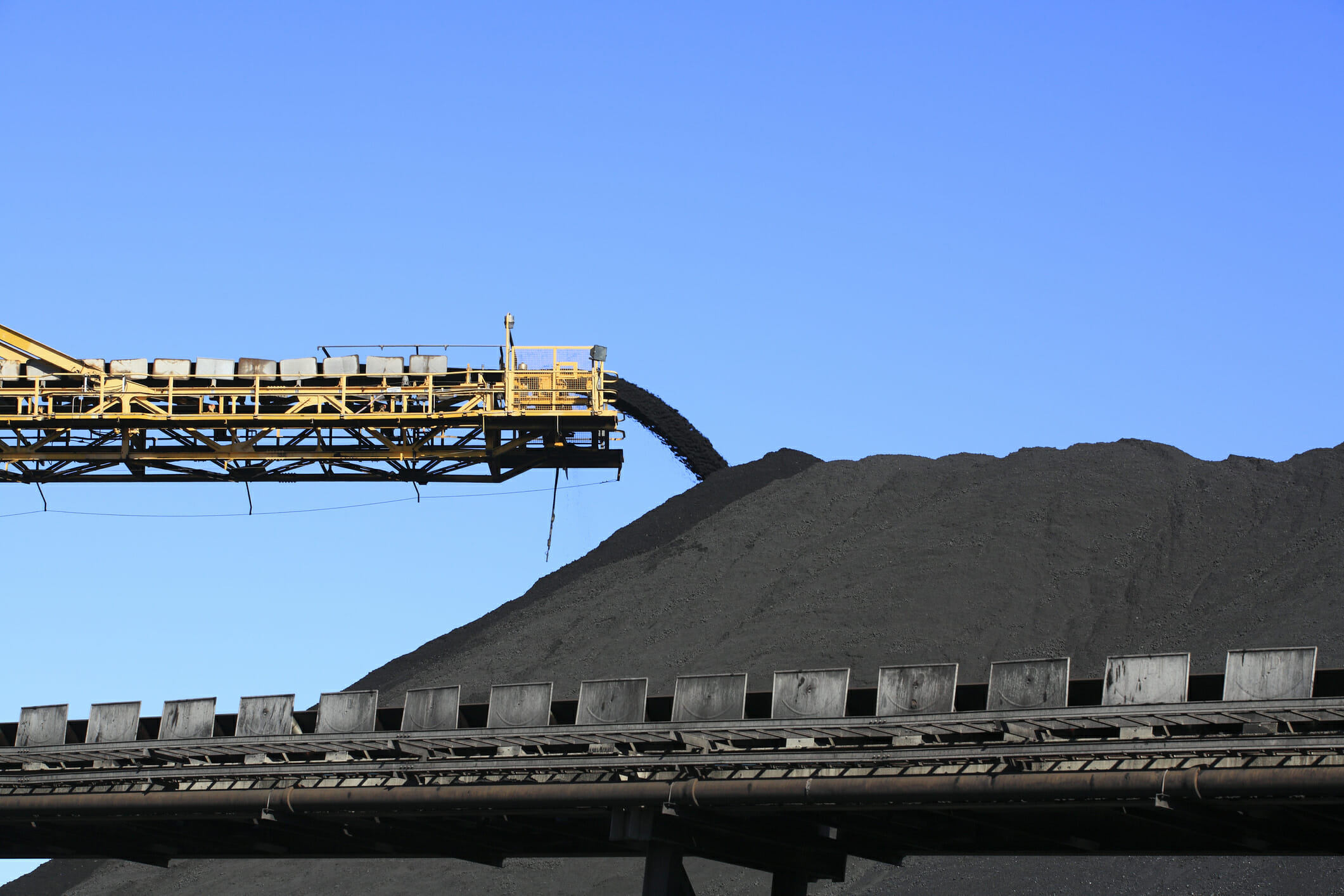 A conveyor belt carrying coal.